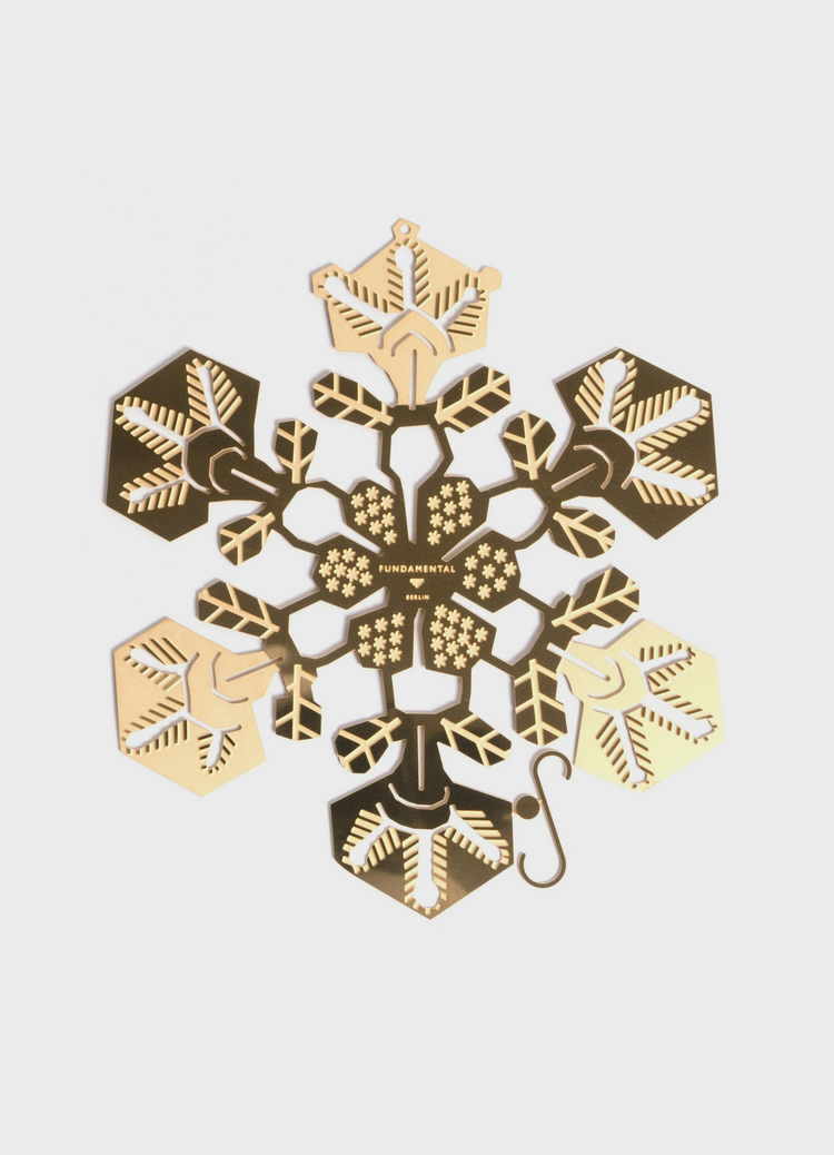 A single 15 cm brass Snowflake ornament, seen from the front